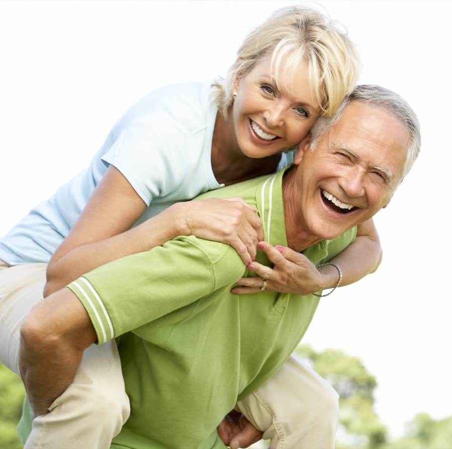 Active couple laughing outdoors