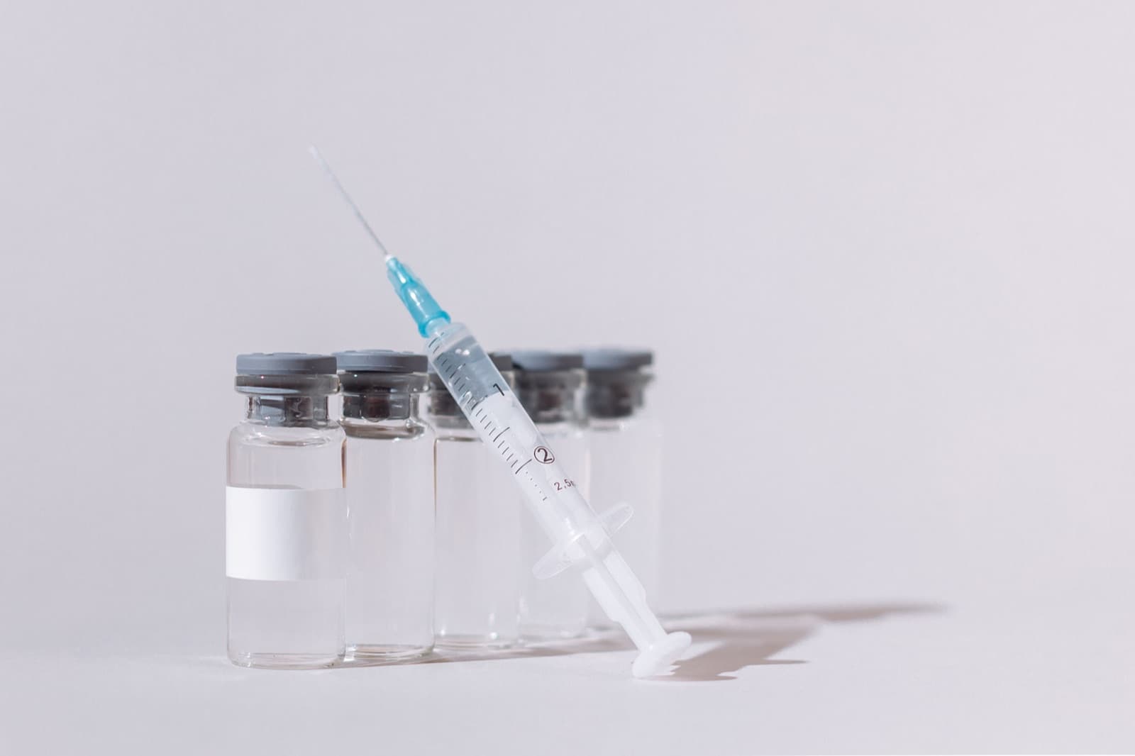 Sterile vials and a syringe prepared for injection